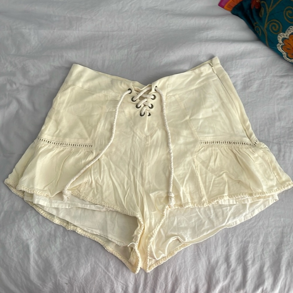 Beige shorts with side zipper. Size XS